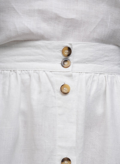 CLARETTE BUTTON FRONT LINEN MIDI SKIRT IN WHITE