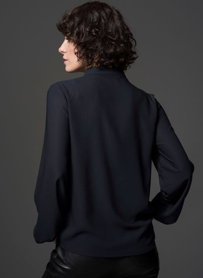 Victoria navy ruffle work shirt viewed from the back